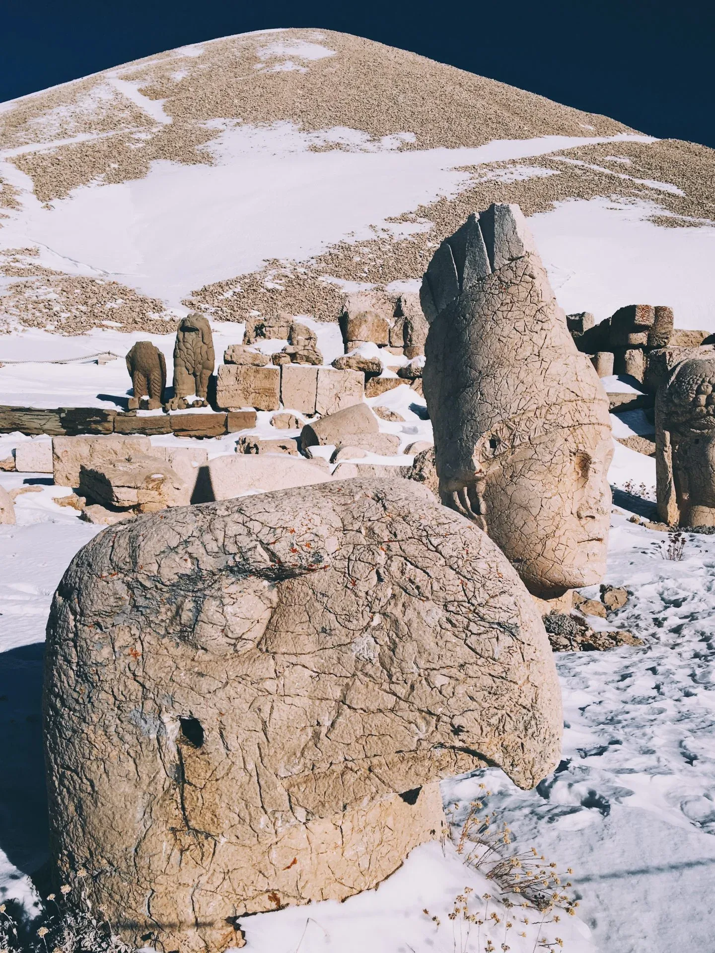 Snow-covered stone figures at Mount Nemrut
