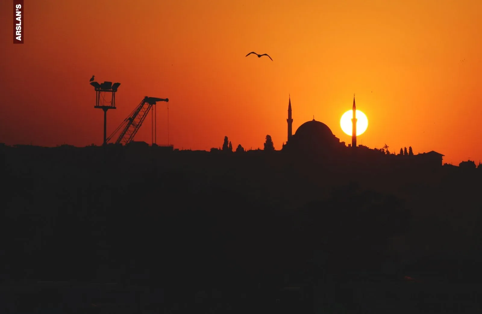 A mosque silhouette at sunset